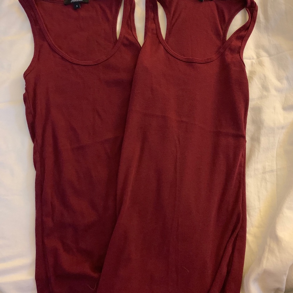 Maroon tank tops.